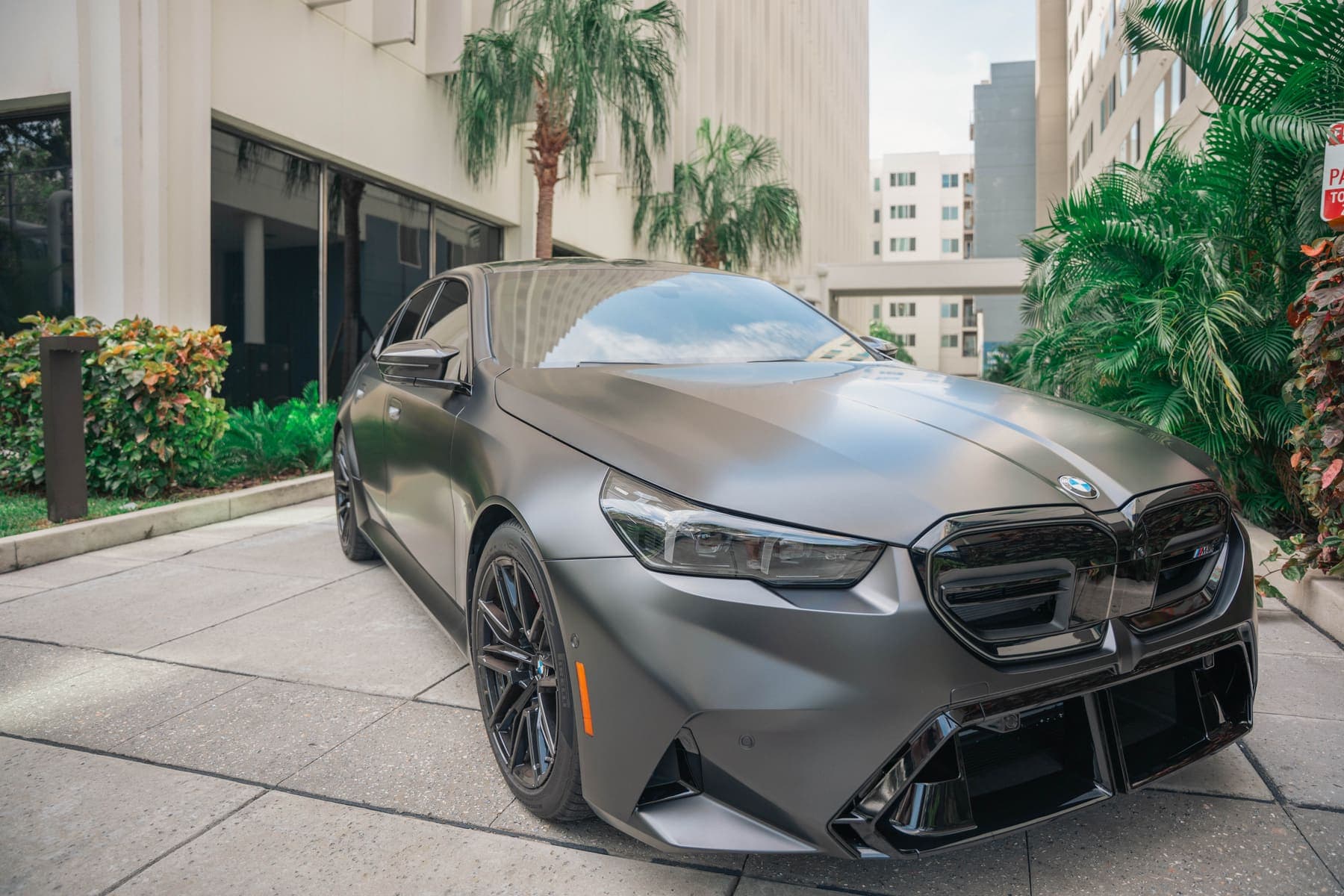 Satin-finish BMW M5 after detailing in downtown Tampa